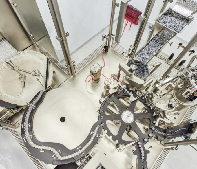 An overhead view of a machine with vials