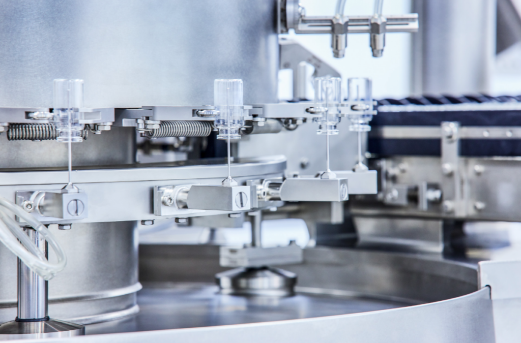 A machine that holds empty vials upside down