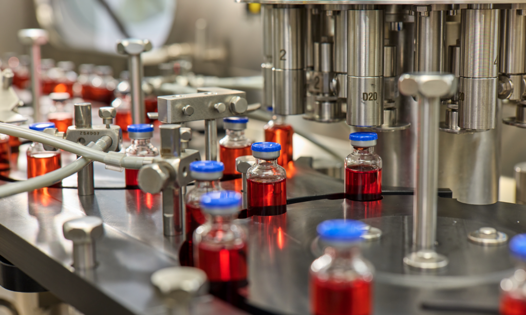 Vials of liquid going through a machine
