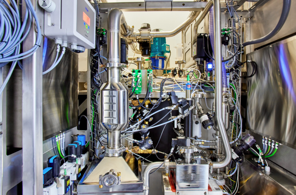 A complex machine with wires and pipes