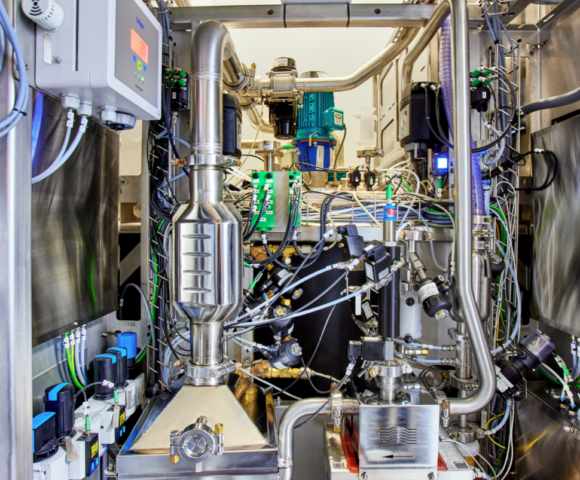 A complex machine with wires and pipes