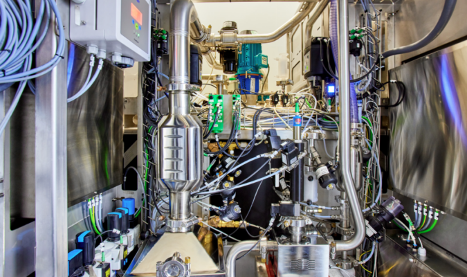 A complex machine with wires and pipes