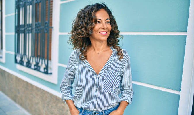 beautiful Hispanic woman outside of building