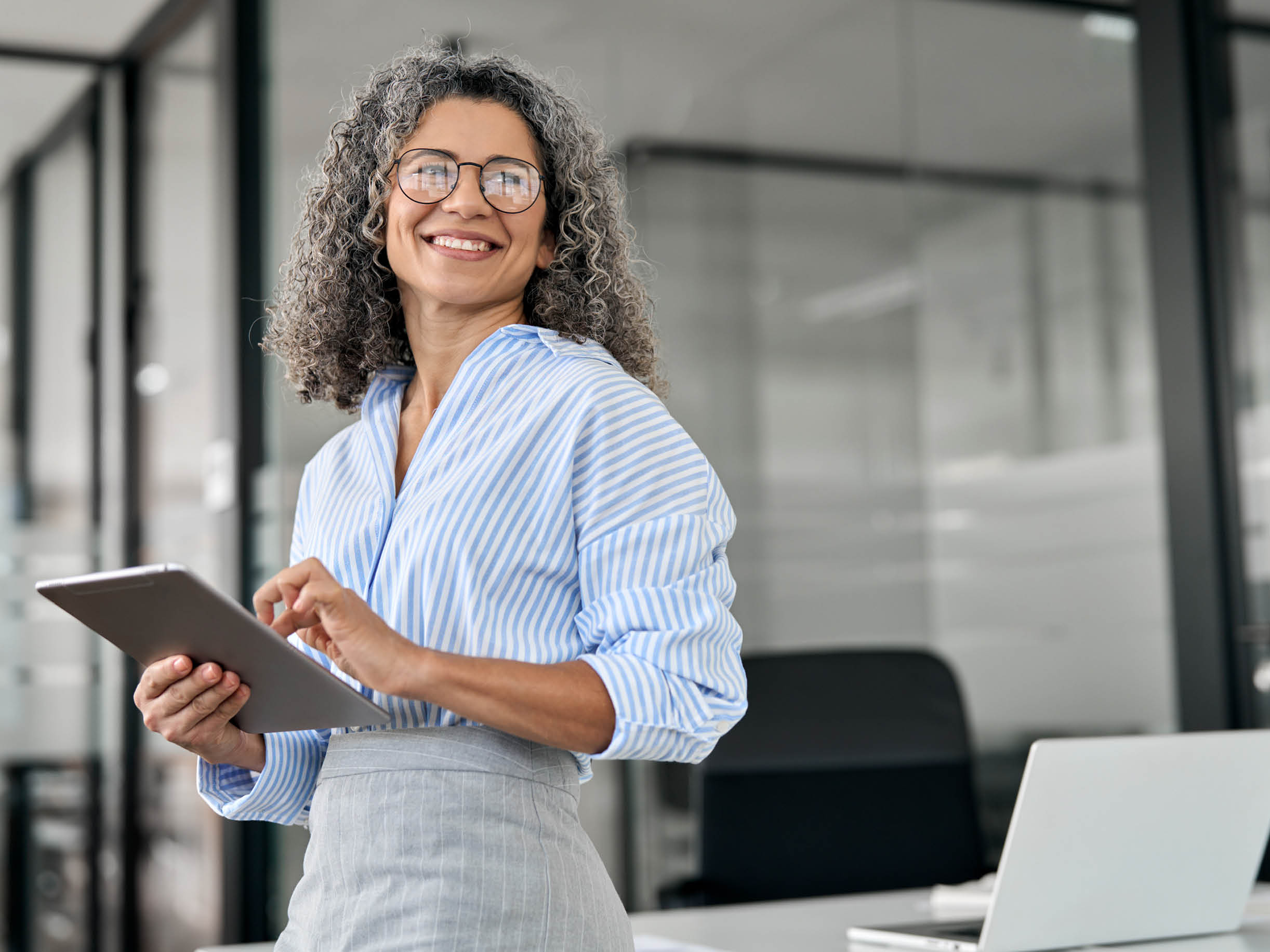 women in office using an iPad