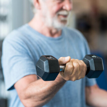 mature man lifting weights